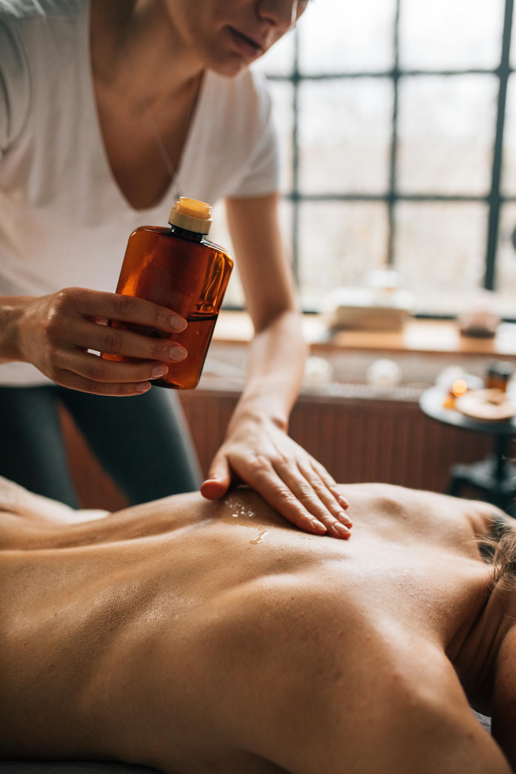 Professional spa massage using essential oils for ultimate relaxation and self-care.