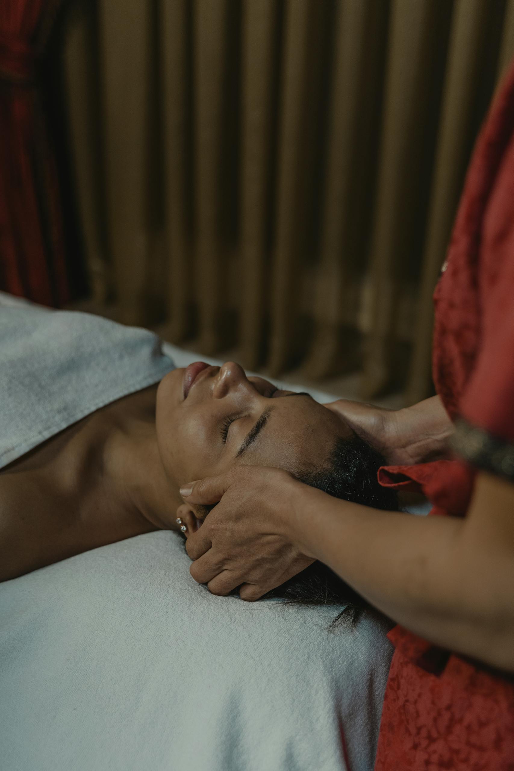 Serene facial massage in a peaceful spa environment promoting relaxation and wellness.
